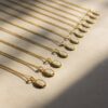 Wholesale Gold Colored Titanium Steel 26 Letter Alphabet Pendant Necklace With O Shaped Chain Fashion Jewelry Accessory For Resale