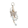 oly-21827aa0f49aba1160f10b2034aa9009 Wholesale Butterfly Pearl Keychain Gold Alloy Women S Fashion Accessory For Car And Bag Boutique Resale