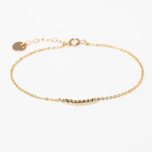 Interrupted small gold bead bracelet