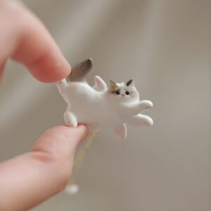 White gray tail pouncing cat