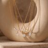 oly-379f5fd3f5a12f256b81c6bba4c4a0ba Wholesale Trendy Y Shape Gold Plated Copper Tassel Necklace With Teardrop Pendant Fashion Jewelry Accessory For Boutique Resale And Gift