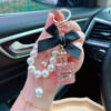 Wholesale Trendy Rhinestone Bow Perfume Bottle Keychain Pearl Chain Bag Charm For Women Wedding Gift Car Key Accessory