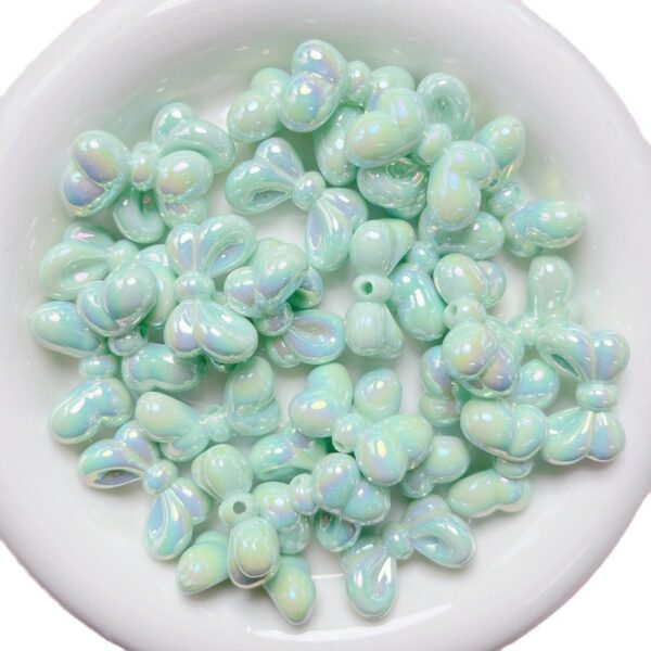 oly-48d51f6a2ff630200ef1a42d26adb319 Wholesale Bowtie Acrylic Loose Beads UV Plated Light Pink DIY Supplies for Phone Charms Keychains Bag Crafts