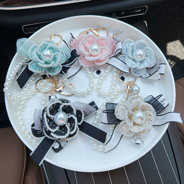 oly-4bf9f4914d8f1a3d9e609fa1716922a7 Wholesale Zinc Alloy Camellia Bow Bag Charm Keychain Black Pearl Chain Car Key Accessory Chic Boutique Resale