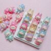 oly-4c490d46f6fc624eaa53153b9eae5a67 Wholesale UV Coated Glitter Glow in the Dark Cute Cartoon Resin Loose Beads for DIY Phone Charm, Bag Charm, and Gift Making OLY Exclusive