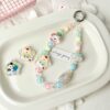 oly-5cc464067a0cf499102cd518938e41de Wholesale Cute Puppy Rainbow Star Printed Acrylic Loose Beads for DIY Phone Charm Jewelry Making Bag Charm Resale Accessory