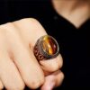 oly-65b36d8ce62695b73ddcfad398826703 Wholesale Antique Silver Zinc Alloy Ring Tiger Eye Flame Design Unisex Statement Jewelry Accessory For Everyday Wear And Boutique Resale