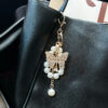 oly-6a4b4c730a63a4768f9634d336600b80 Wholesale Butterfly Pearl Keychain Gold Alloy Women S Fashion Accessory For Car And Bag Boutique Resale
