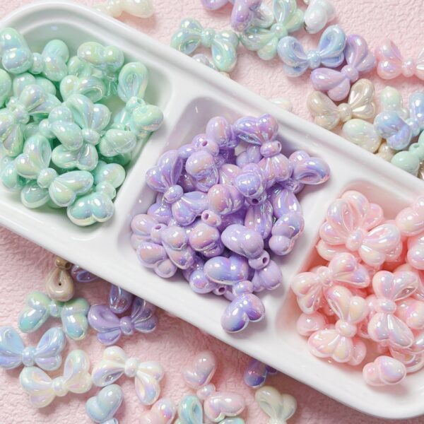 oly-8060df573c947bfc50403265917af2f6 Wholesale Bowtie Acrylic Loose Beads UV Plated Light Pink DIY Supplies for Phone Charms Keychains Bag Crafts