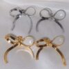 oly-80ce87f1f4eea964440f28ec9ef48855 Wholesale Trendy Bow Design Earrings Tone Titanium Steel Electroplated Fashion Accessory For Women Great For Party And Gift