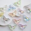 oly-8841560c665dea898cd0e7aa56c91f44 Wholesale UV Plated Transparent Angel Heart Acrylic Beads for DIY Phone Charms Keychains Boutique Resale