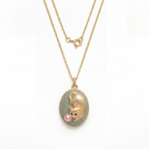 Golden cat playing ball necklace