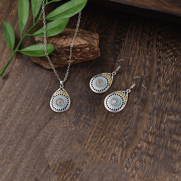 oly-9dacd09ece09fc8f3567e378c2bf523a Wholesale Retro Bohemian Carved Hollow Pendant Earrings And Necklace Set Zinc Alloy Fashion Jewelry Accessory For Casual Wear