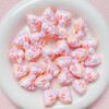 Wholesale Chic Hand Painted Acrylic Bow Loose Beads Light Yellow DIY Phone Strap and Bag Charm Craft Supplies for Resale