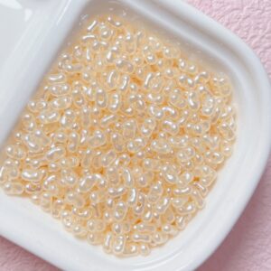 E29-04-Light Orange / The size is about 4*6.5mm, the aperture is about 1.2mm