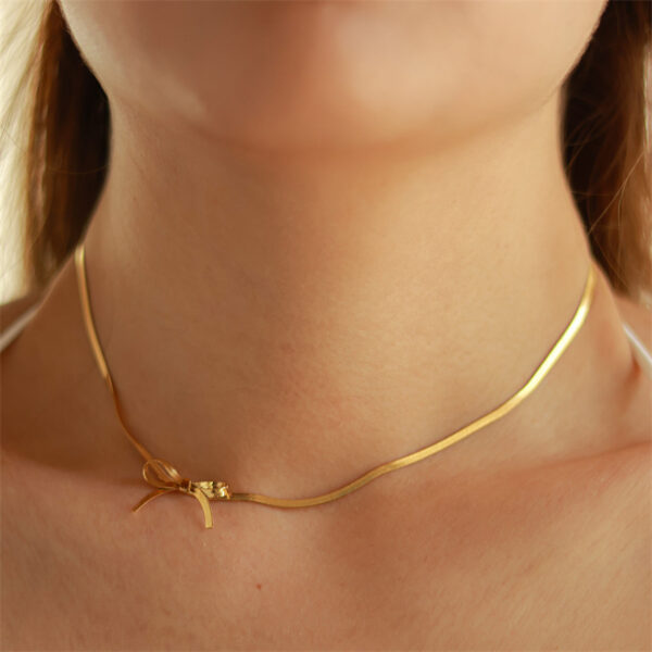 oly-abc2b21e28da0f50427b1d228f3fdaa5 Wholesale Titanium Steel Bowknot Necklace Titanium Steel Electroplated Snake Bone Chain Sweet Bowtie Pendant Fashion Accessory Boutique Resale Gift