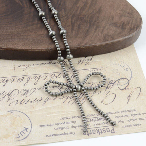 oly-b22e3bea03451abe3e681c96a4606d6e Wholesale Bronze Electroplated Zinc Alloy Beaded Bow Choker Necklace Retro Denim Style Fashion Accessory