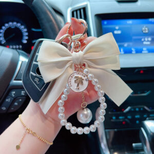 oly-b5c8265cae3450312f6e0cd9c1d25e17 Wholesale Large Bow Pearl Chain Keychain For Women Car Key Accessory Handbag Charm Boutique Resale