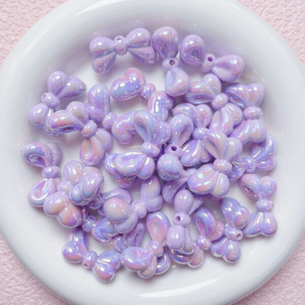oly-b6276a0ec44b76737caf532476067775 Wholesale Bowtie Acrylic Loose Beads UV Plated Light Pink DIY Supplies for Phone Charms Keychains Bag Crafts