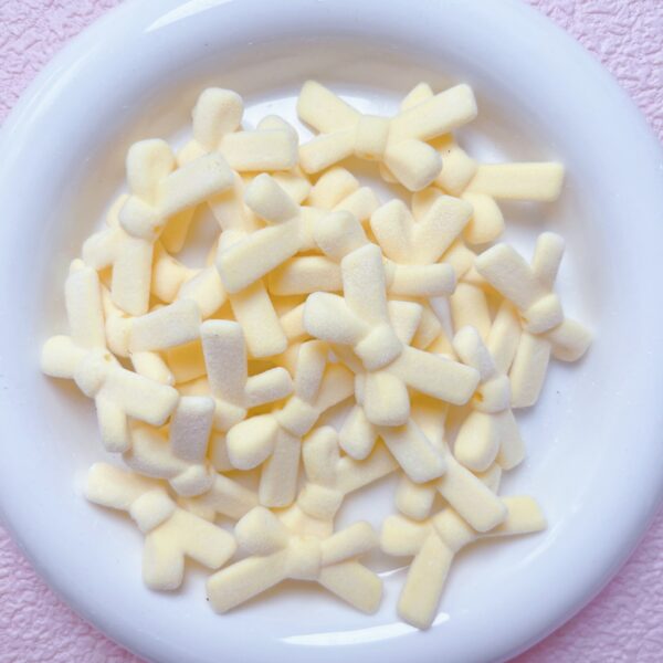 oly-be52fdef0760203c1cb77ba81e766f84 Wholesale Flocked Acrylic Bow Tie Beads Cream Yellow - DIY Loose Beads for Jewelry Making, Phone Charm, Party Gift Accessories