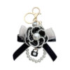 oly-bf475993761b6e50a555a6f3d00320a4 Wholesale Zinc Alloy Camellia Bow Bag Charm Keychain Black Pearl Chain Car Key Accessory Chic Boutique Resale