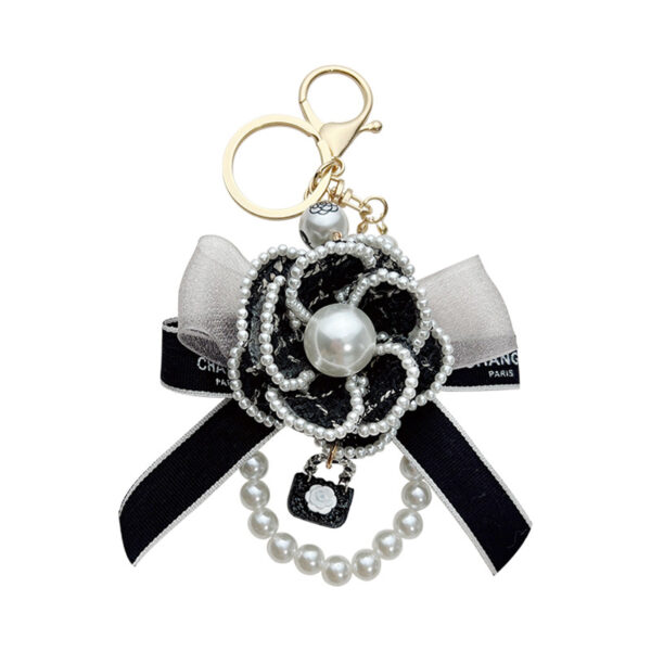 oly-bf475993761b6e50a555a6f3d00320a4 Wholesale Zinc Alloy Camellia Bow Bag Charm Keychain Black Pearl Chain Car Key Accessory Chic Boutique Resale