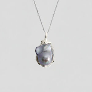 Silver necklace with gray and purple shaped pearls