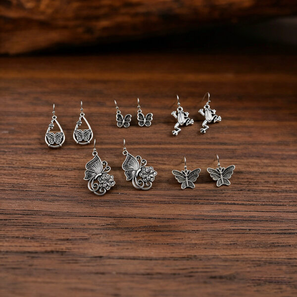 oly-c5a715eb1ead5eda67de41f0c585c744 Wholesale Retro Ethnic Butterfly Flower Hollow Teardrop Earrings Alloy Women S Fashion Accessory Party Gift