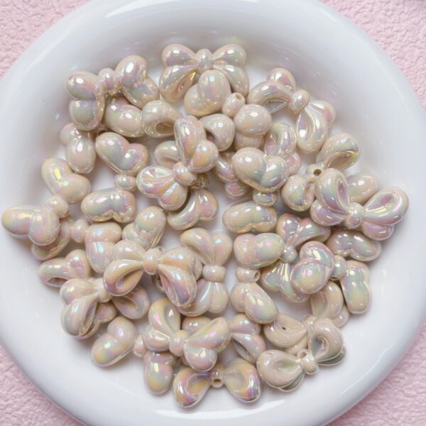 oly-cfd02c3b4a40d99747fe551d2c332d85 Wholesale Bowtie Acrylic Loose Beads UV Plated Light Pink DIY Supplies for Phone Charms Keychains Bag Crafts