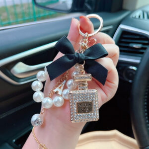 oly-da3246df6960a890781fb8a6bf92d863 Wholesale Trendy Rhinestone Bow Perfume Bottle Keychain Pearl Chain Bag Charm For Women Wedding Gift Car Key Accessory