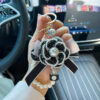oly-df2ffb029e5ac3493f90d2c19eff2237 Wholesale Zinc Alloy Camellia Bow Bag Charm Keychain Black Pearl Chain Car Key Accessory Chic Boutique Resale