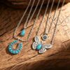 oly-e9d981e349644e6b2beff6fd4d5f91f0 Wholesale Vintage Western Turquoise Butterfly Horseshoe Long Chain Necklace Fashion Accessory Boutique Resale Gift