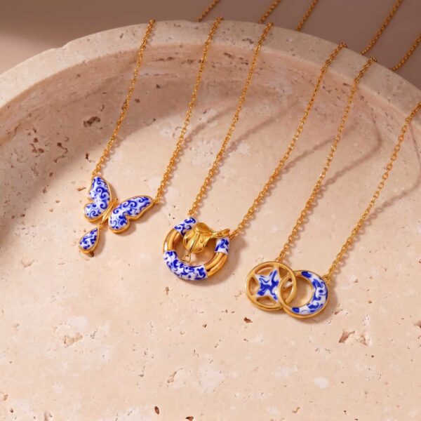oly-f15b842e18d4e9f500b11f0aff6590cb Wholesale Stylish Stainless Steel Blue Porcelain Star Moon Drop Pendant Necklace Electroplated Finish Boutique Resale Jewelry Accessory