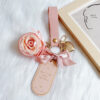 oly-f377b6e7c4ad9412557ec59caf5e7f9f Wholesale College Style Pink Leather Keychain With Preserved Fresh Bag Charm Gift For